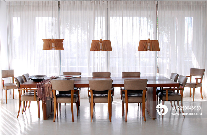 Pendant lights hanging over dining table; Argentina