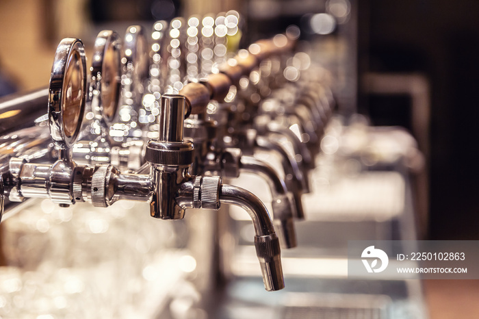 Broad variety of draft beer pipes in a pub ready for serving beer