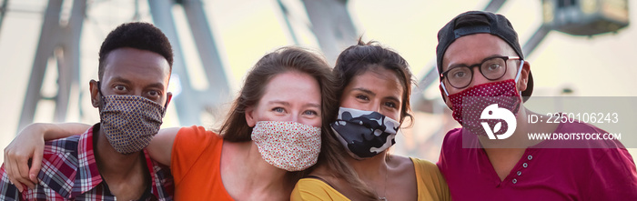 Group of multiracial friends taking photo with face mask on