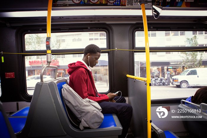 Teenage boy traveling by bus