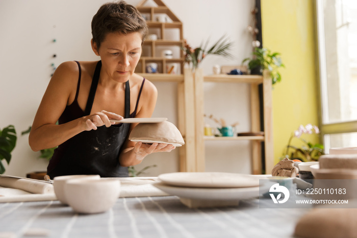 Young woman ceramic and pottery tableware