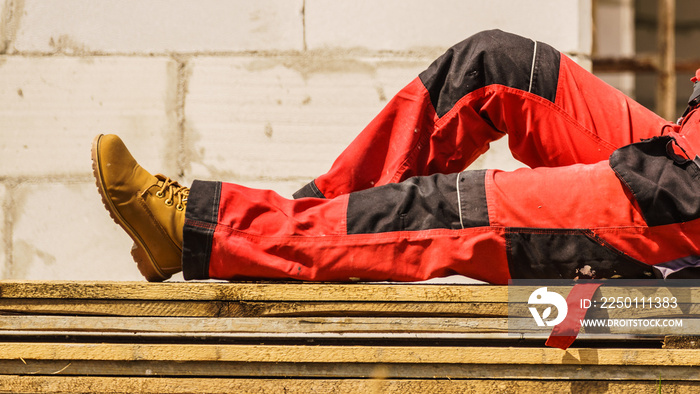 Person wearing red worker trousers