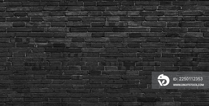 Texture of old black brick wall large background.