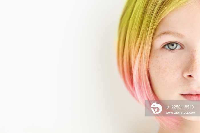 Trendy hairstyle concept. Girl with colorful dyed hair on white background