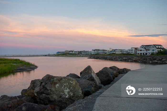 A Concrete Path With an Orange and Blue Sunset Sky Behind It at the North Wildwood Sea Wall in New J