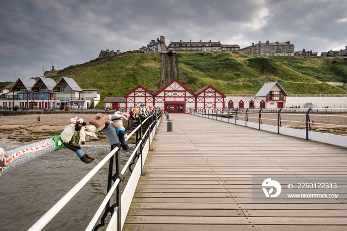 Saltburn Pier and town beyond, at Saltburn by the Sea which is a Victorian seaside resort, with a pi