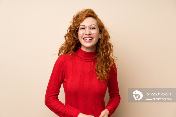 Redhead woman with turtleneck sweater with glasses