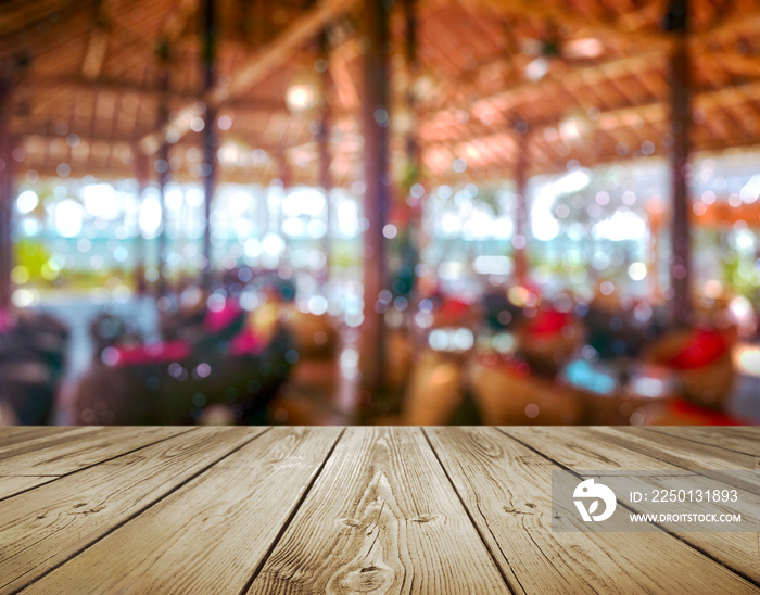 Rustic wood table with blurred bokeh beach resort background