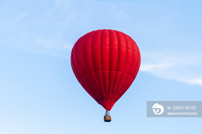 (aeronautics) Balloon flies across the blue sky