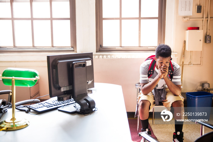 Student waiting in directors office