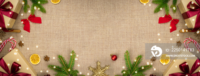 Christmas background with red and green ornaments on linen background. Merry Christmas greeting card