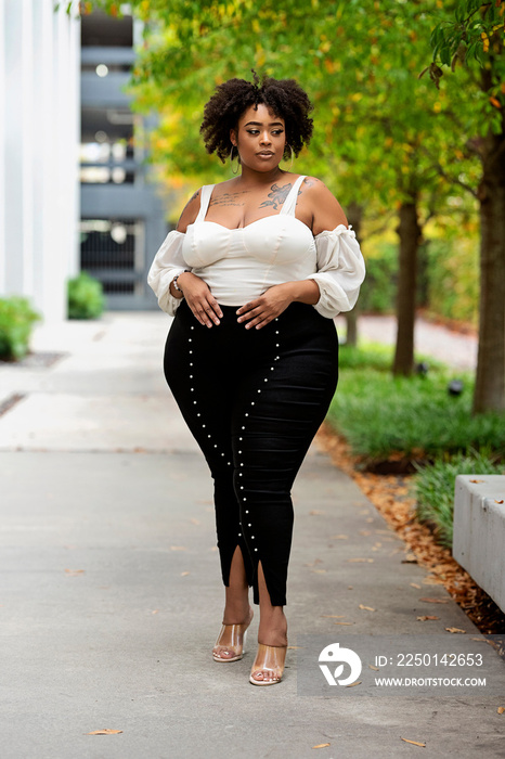 Plus size fashion forward Black woman outside