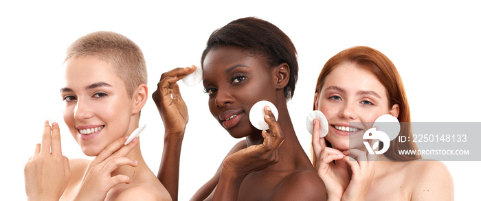 Skin care for everyone. Three positive multicultural young women removing makeup from face with cott