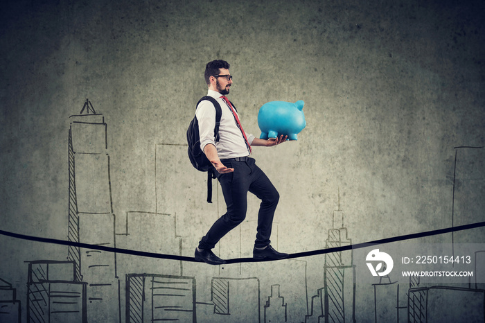 man with backpack and piggy bank walking balancing on a rope above a city skyline