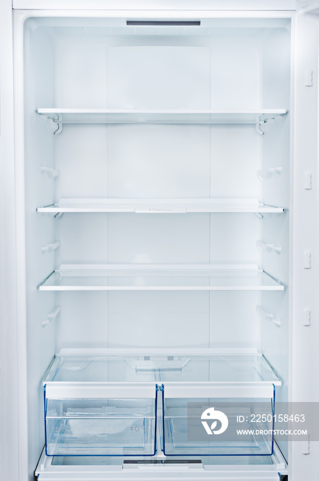 Empty Refrigerator with door open.Vertical photo and copy space