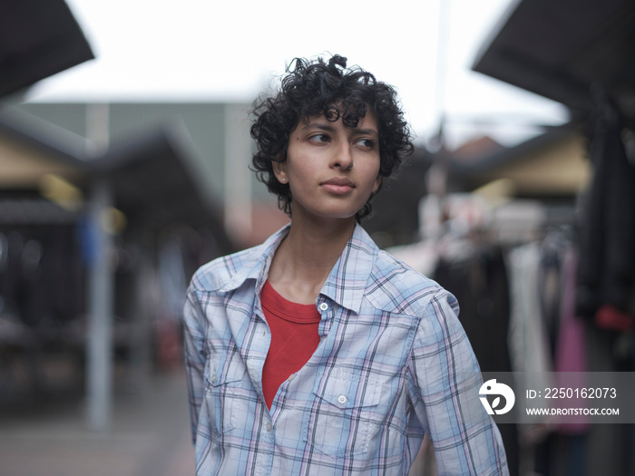 Smiling woman standing in street market