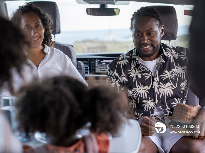 Family with daughter (2-3) camping in camper van