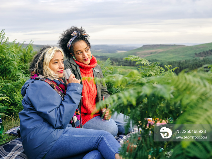 Female hikers having picnic