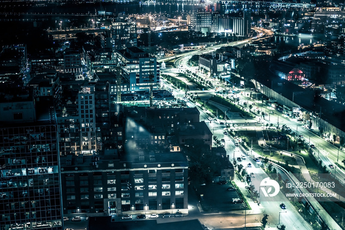 Night buildings with lights and cars at night in Montreal