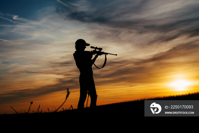 Female Hunter silhouette in Sunset.