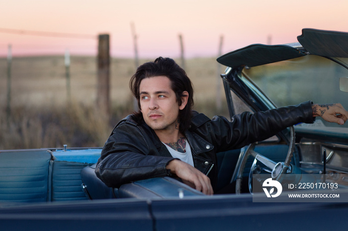 Young man in convertible