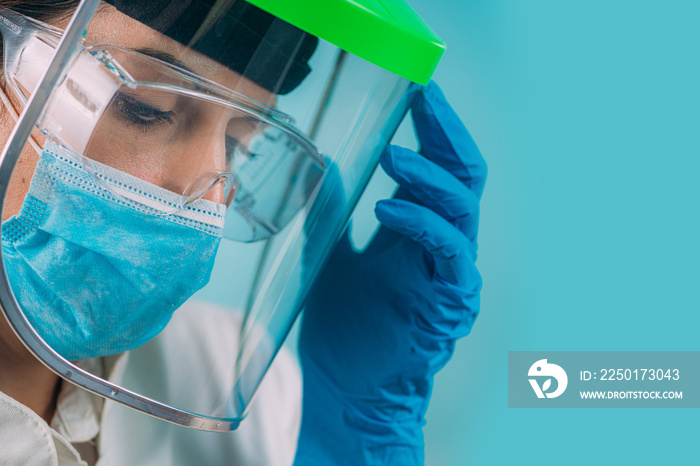 Close-up of Highly Stressed Female Medical Worker’s Face in Hospital During Coronavirus Outbreak.