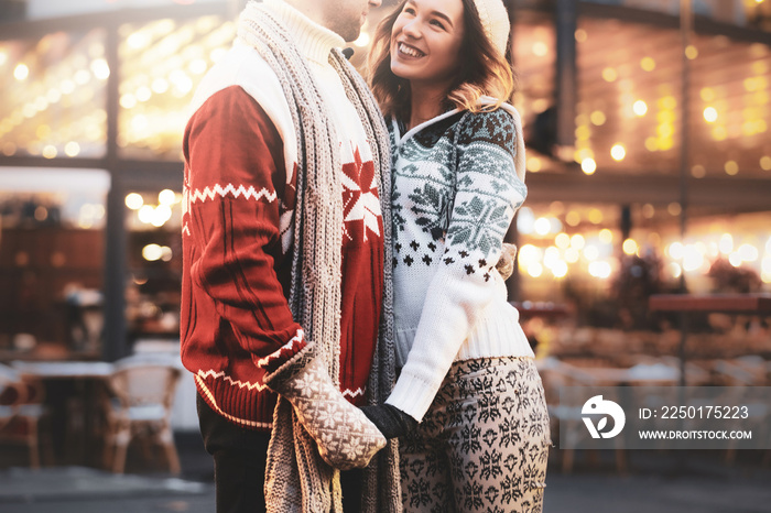 At traditional festive market attractive couple enjoy Christmas day while have a date.