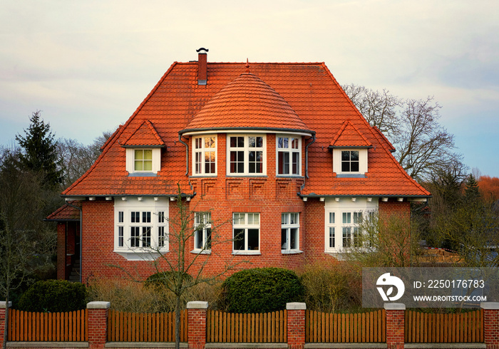 Facade of a german brick house in the evening sun. Mecklenburg-Western Pomerania, Germany.