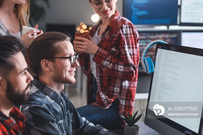 Team of programmers working in office