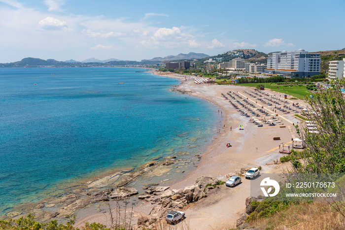 View of bay with sandy beach in Faliraki. Rhodes island, Dodecanese, Greece.