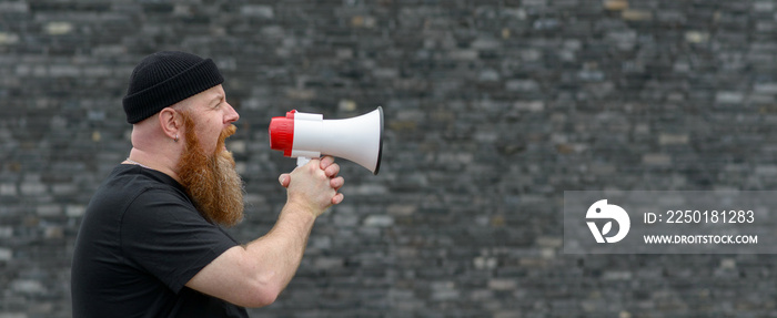 Man with a grievance yelling into a megaphone