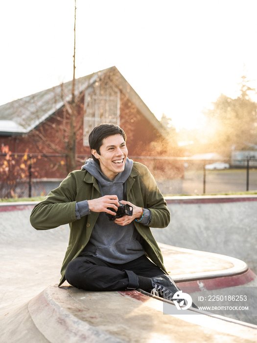 Young Indigenous adult male photographer outdoors