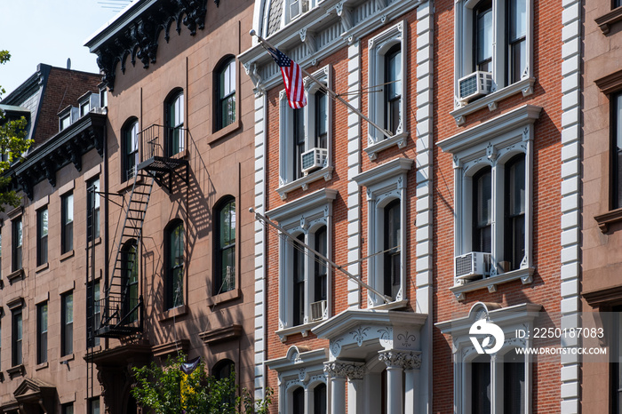 Street scene and apartment buildings of Brooklyn Heights in summer sunny daylight