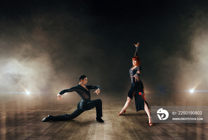 Elegant dancers, pair dancing on stage