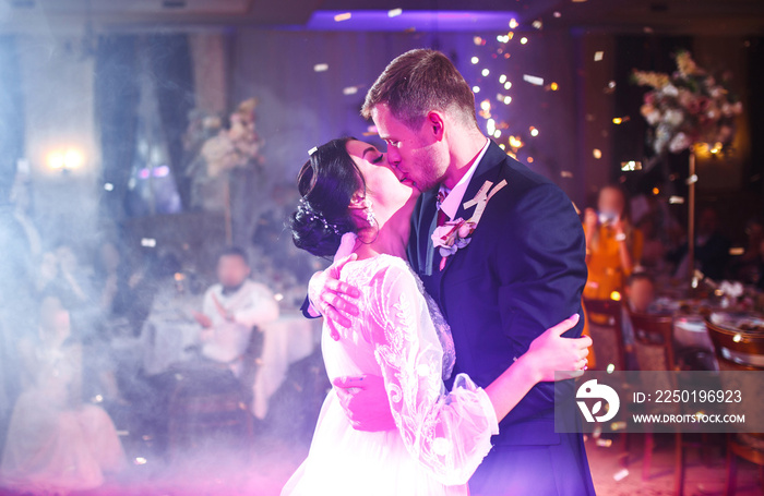 First wedding dance of newlywed. Happy bride and groom and their first dance in the elegant restaura