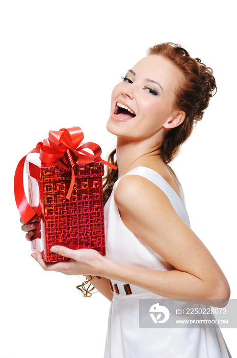 Cute laughing girl holding the red box present