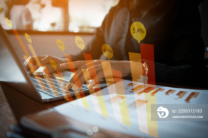 The hand of a business woman using a laptop to analyze market data to determine marketing strategy.