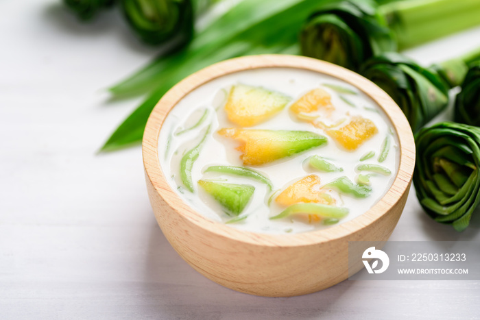 Thai dessert (Lod Chong), rice flour pandan flavor and sliced melon fruit in coconut milk	