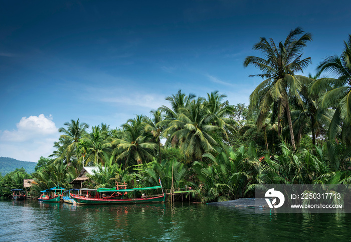 traditional jungle boat at pier on tatai river in cambodia