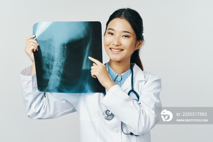 female doctor looking at an xray