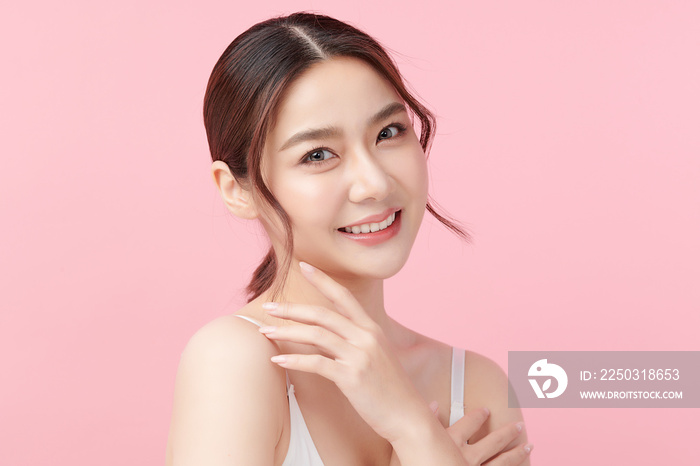 Beautiful young asian woman with clean fresh skin on pink background, Face care, Facial treatment, C