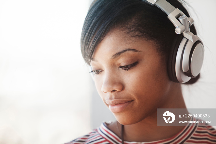 Young woman listening to music