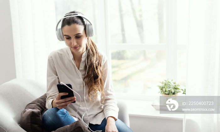 Woman listening to music at home