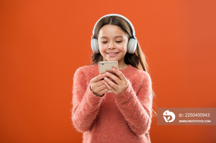 small kid listen ebook, education. small girl child in headphones. Childhood happiness. Mp3 player. 