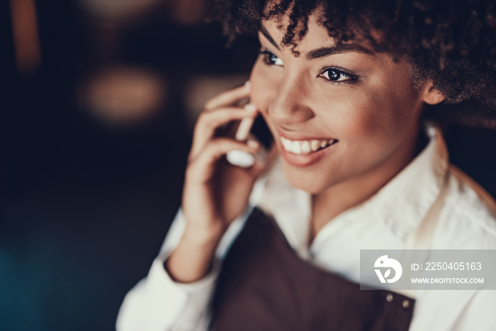 Pretty lady looking aside and speaking on phone