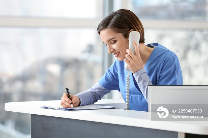 Female receptionist working in clinic