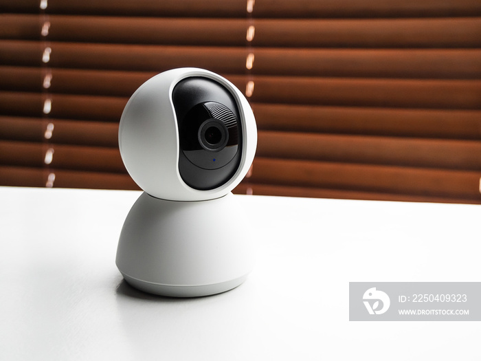 web camera for indoor video surveillance. home security and modern technology concept