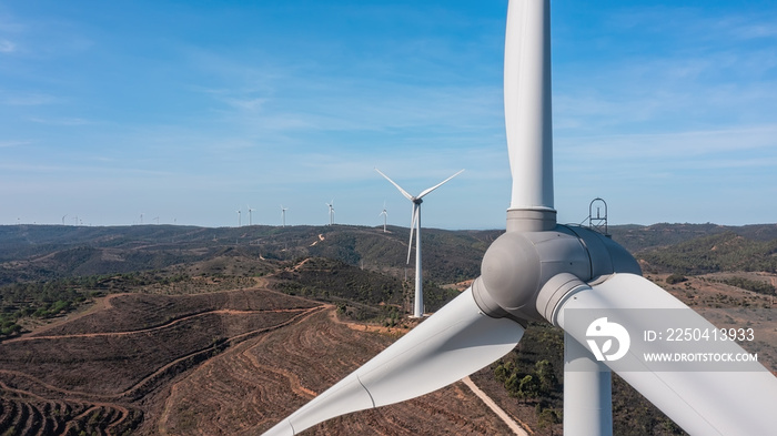 Aerial view wind turbine eco friendly renewable energy concept on Portuguese mountains background.