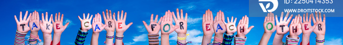 Children Hands Building Colorful English Word Take Care For Each Other. Blue Sky As Background