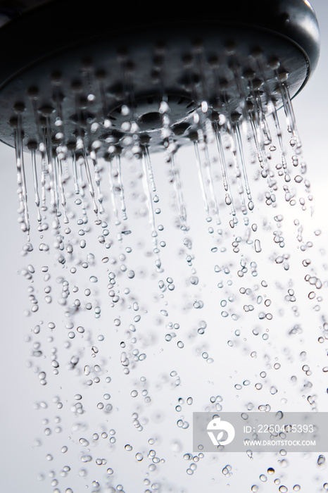 Falling water drops and shower head.